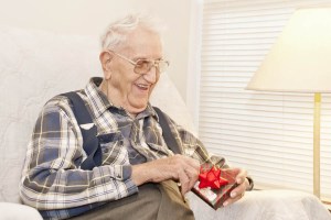 \"Elderly-Man-Opening-Gift